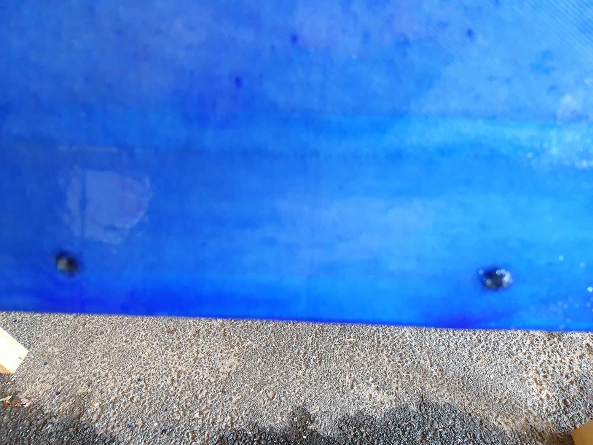 Deck line holes with singed edges