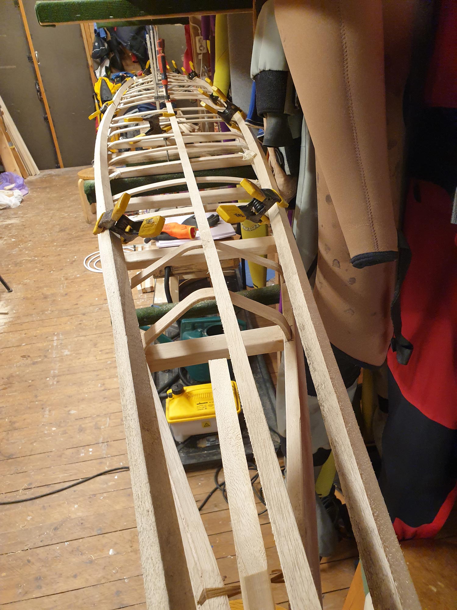 Tried ribs with grooves to control the bend. Kinda worked.
