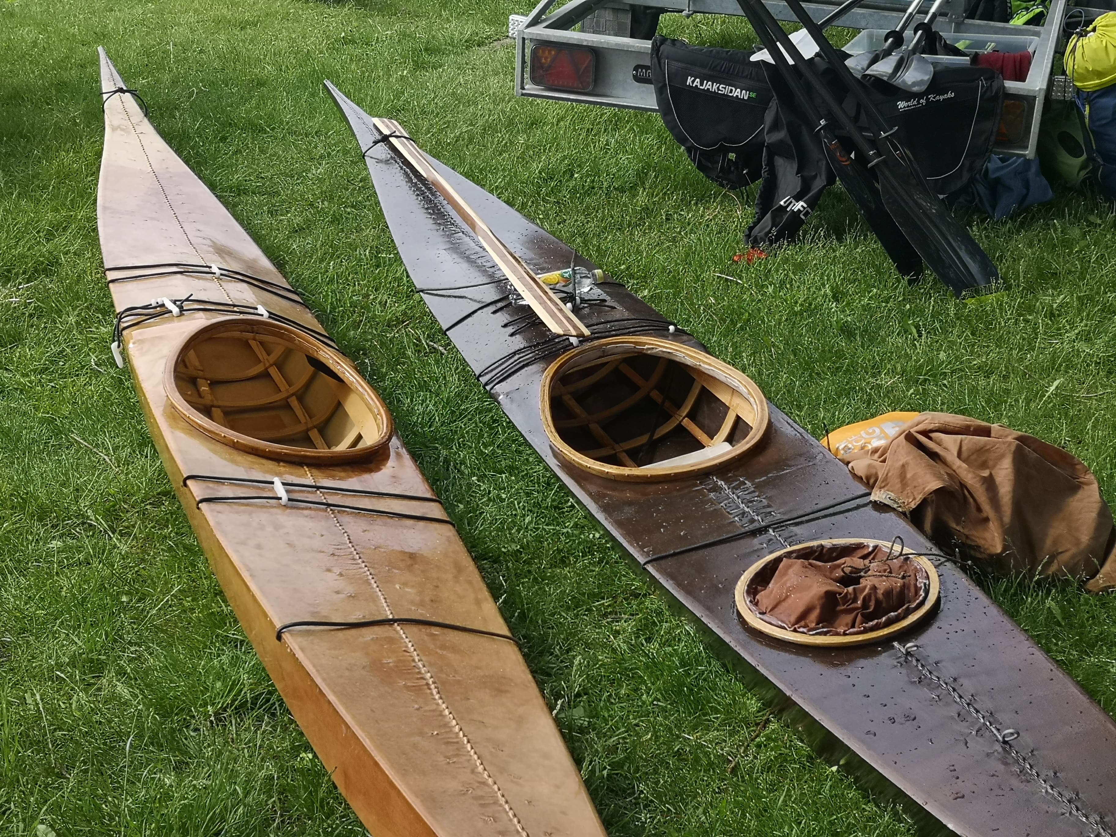 West and East Greenland style kayaks from left to right, sans the experimental hatch