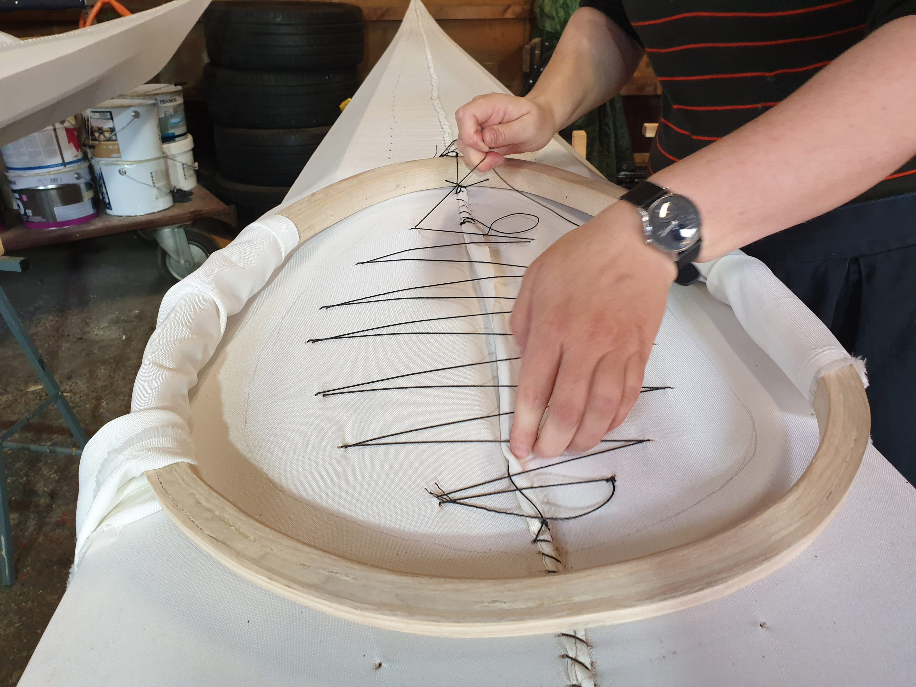 The ziggety-zags keep the fabric tight around the coaming