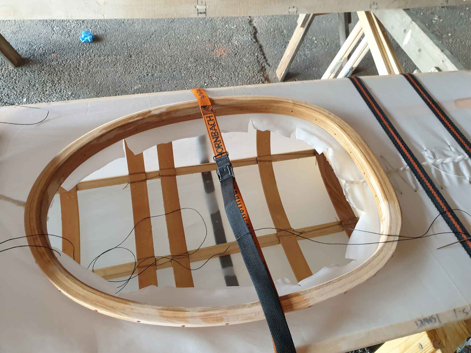 Relief cuts to fold the fabric along the inside of the coaming